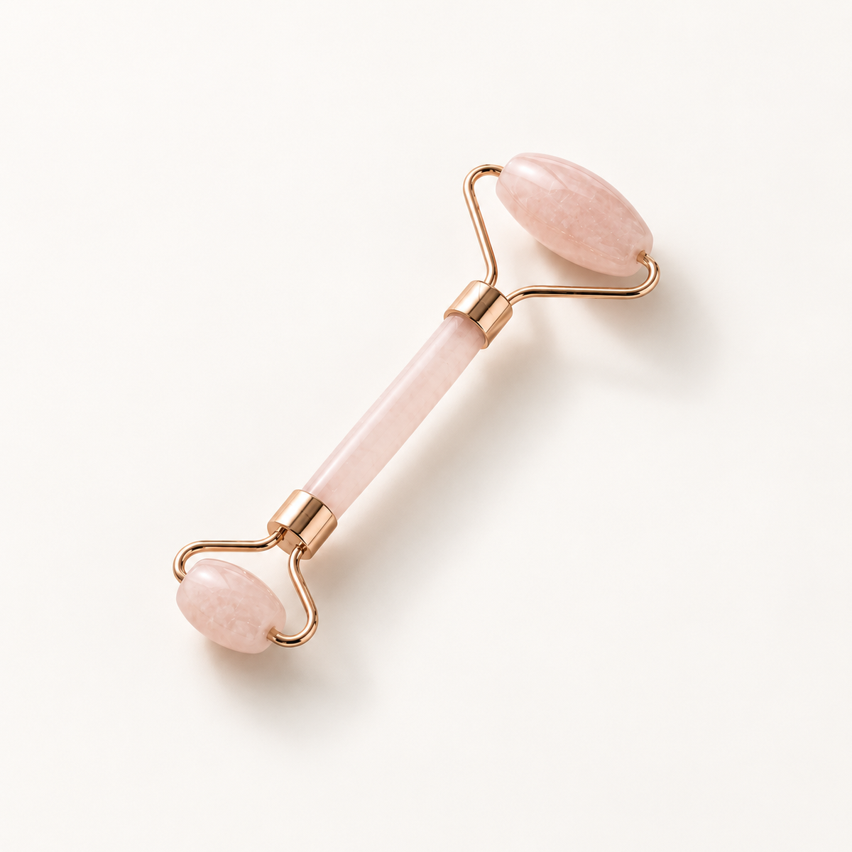 רולר קוורץ ורוד לעיסוי פנים ומיצוק – Rose Quartz Facial Roller